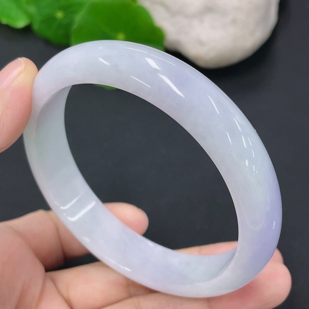 HKHQ Jadeite round bangle, 58mm, weighing approximately 48.73g, showcasing smooth jade surface and polished finish.
