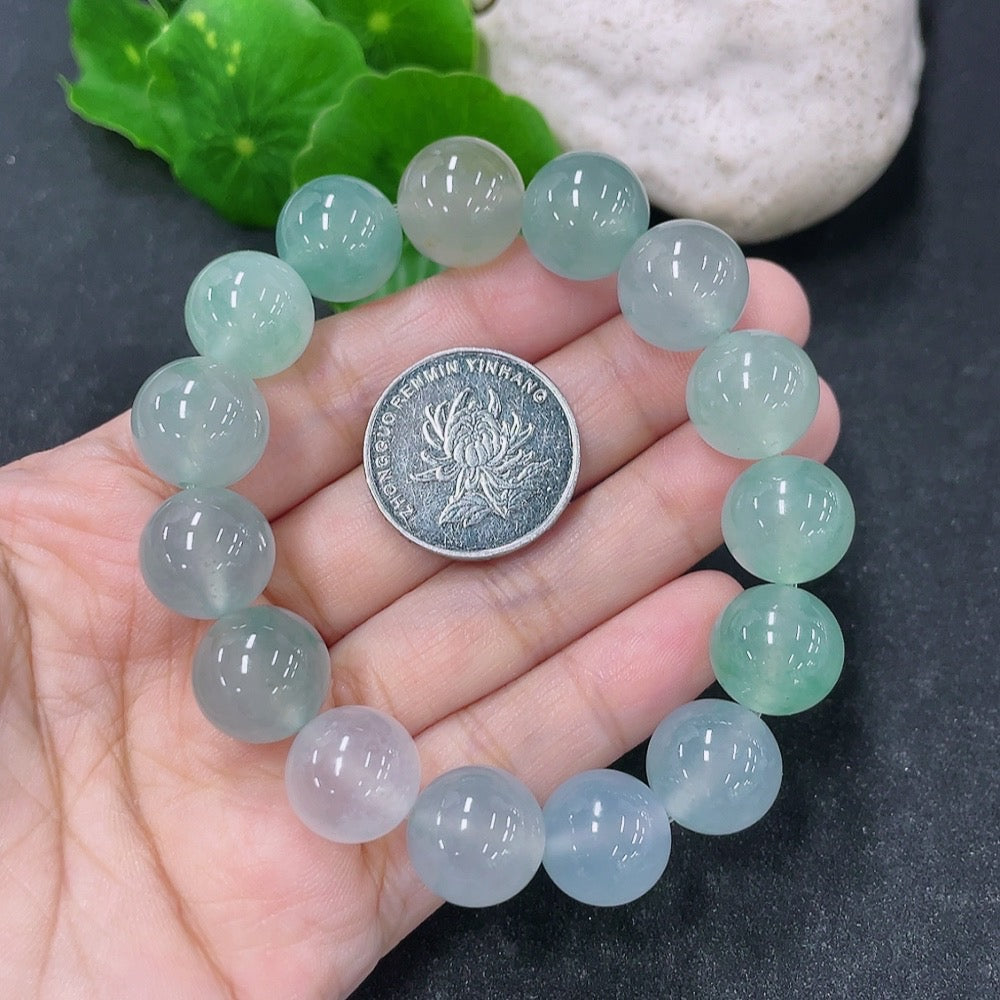 HKHQ jadeite bracelet with 13.4mm stones, weighing approximately 56.13g, showcasing smooth, polished jadeite beads.