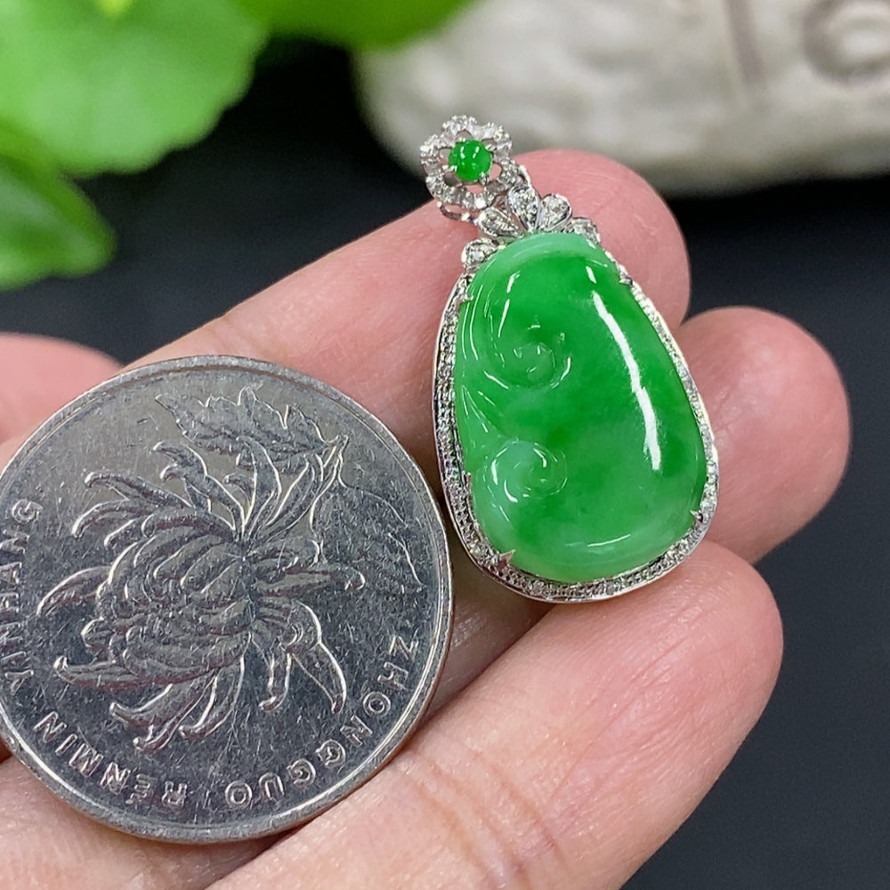Jadeite Ruyi pendant in 18K gold with diamond inlays, featuring intricate jade design and a total weight of about 2 grams.