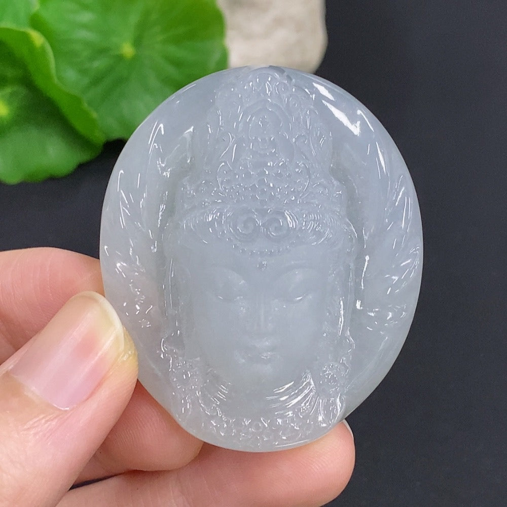 Jadeite Guanyin pendant necklace by HKHQ, featuring a detailed carved figure, weighs approximately 38g, hanging from a silk cord.