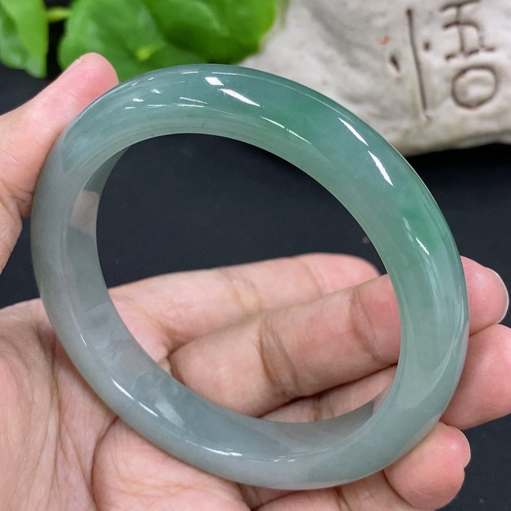 HKHQ jadeite round bangle in size 55.5 with a 53.26g weight, showcasing smooth, polished jadeite craftsmanship.