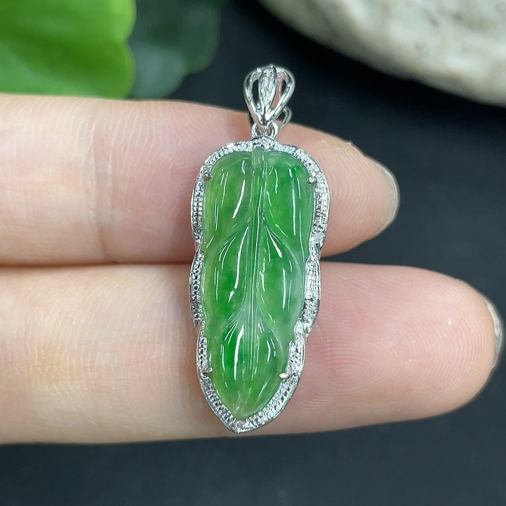 Jadeite leaf pendant in 18K gold with diamond accents, elegant necklace featuring detailed leaf design and sparkling gemstones