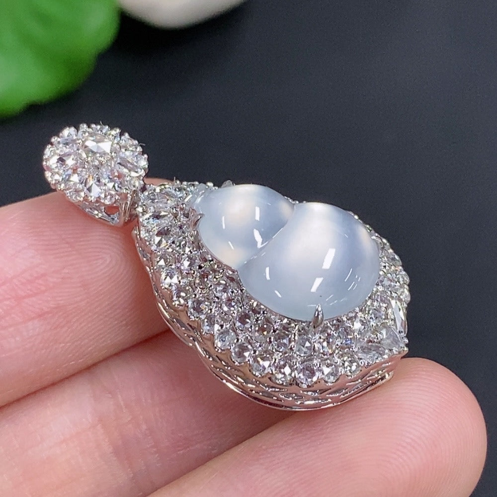 Jadeite gourd inlaid pendant with diamond accents on 18k gold necklace, weighing approx. 7.2g, by HKHQ.