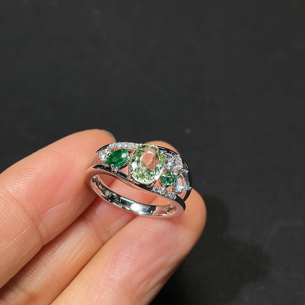 HKHQ gemstone tourmaline ring featuring a large, vibrant tourmaline stone set in a sleek band with intricate details.