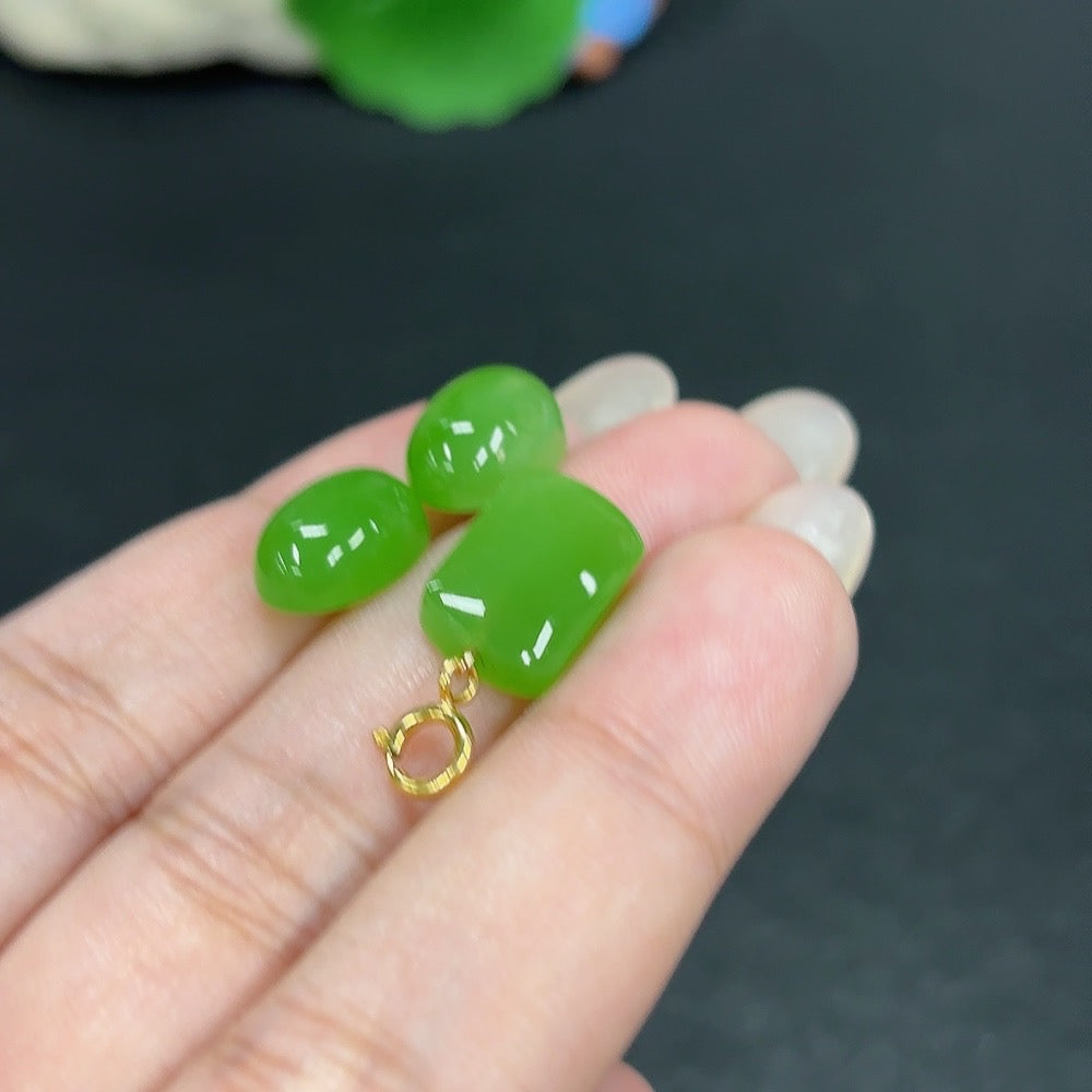 HKHQ Hetian Jade inlaid earrings featuring intricate 18K gold design with matching pendant, showcasing elegant craftsmanship.