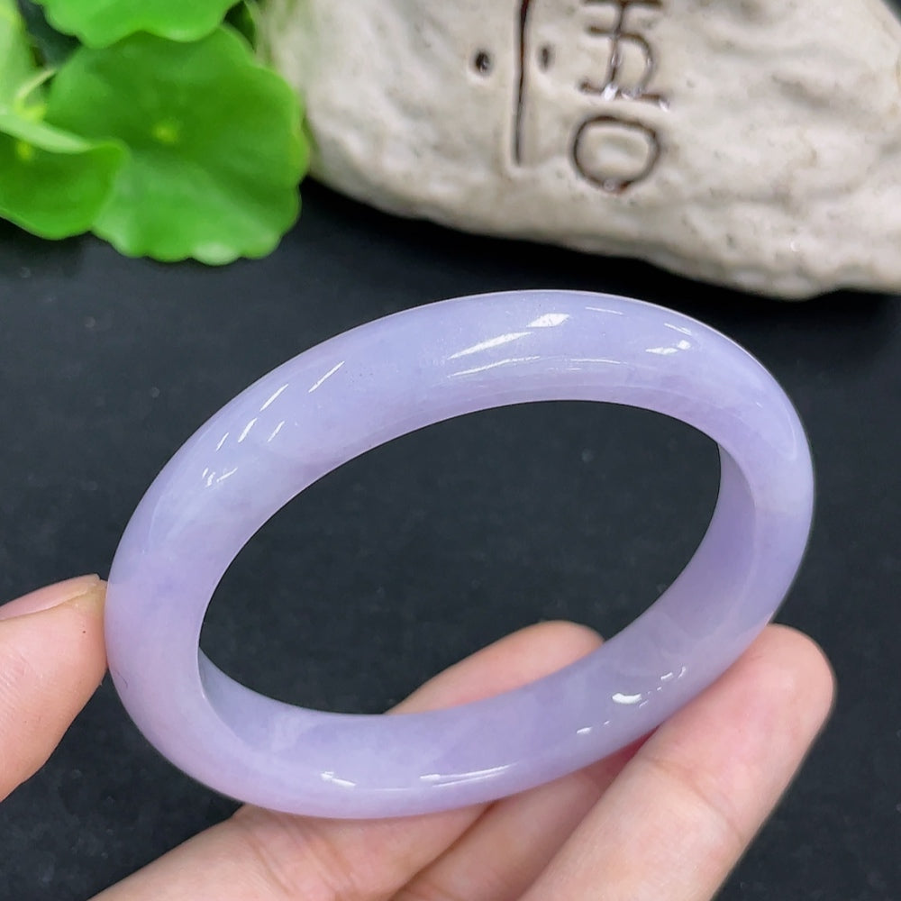 Elegant jadeite concubine bracelet from HKHQ featuring smooth, polished jade stones and intricate design details.