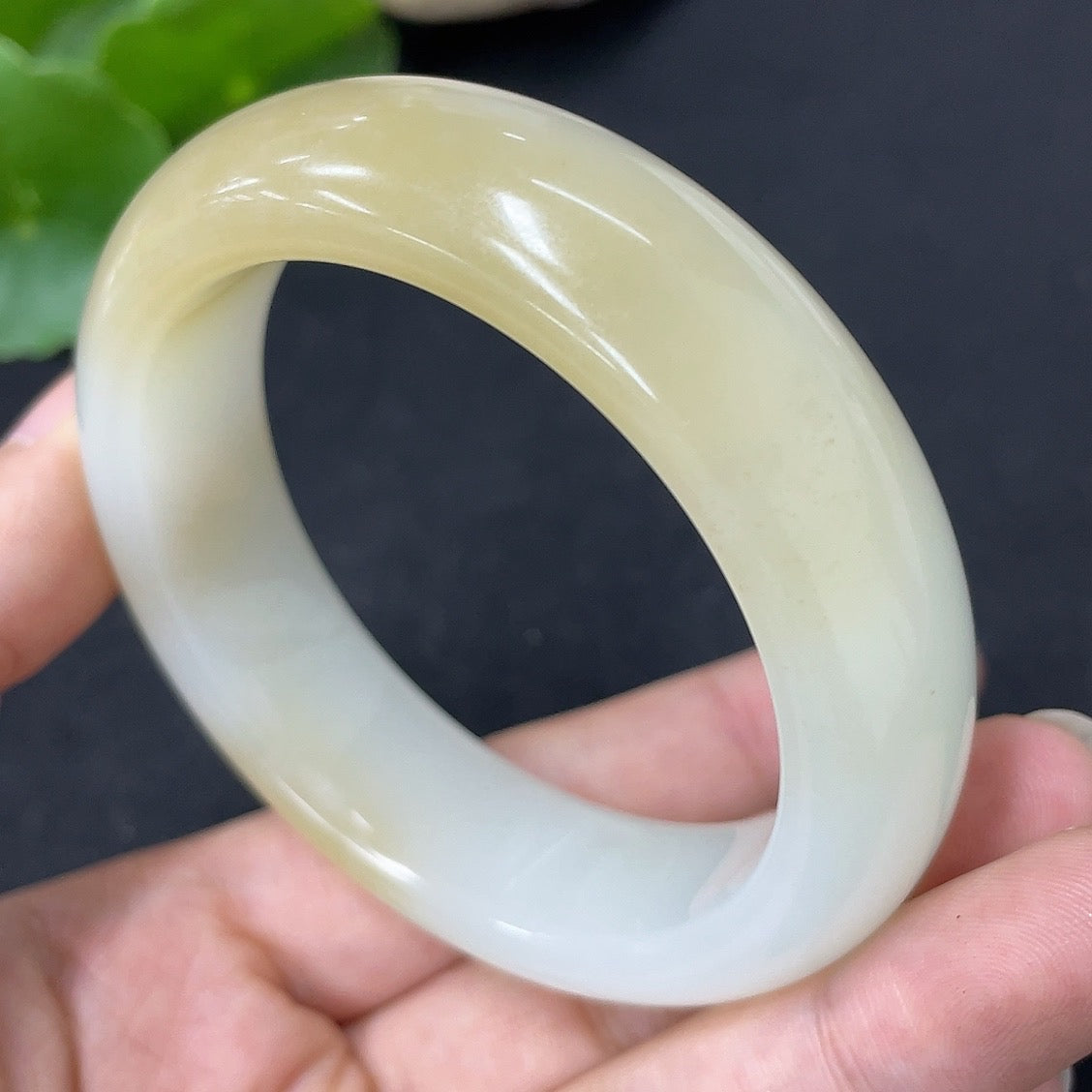 HKHQ Hetian Jade round bracelet, size 54.1, weighing approximately 70.3g, showcasing smooth, polished jade stones.