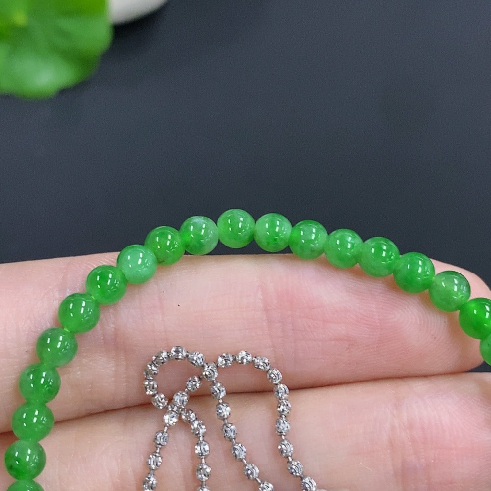 Jadeite single bezel pendant with diamonds, 18k gold, 3.9mm size, on a chain, weighing approx. 8.1g, by HKHQ.