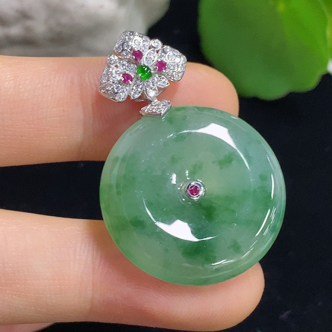 Jadeite Peace Knot pendant in 18K gold from HKHQ, featuring a smooth, polished jade pendant with intricate knot design.