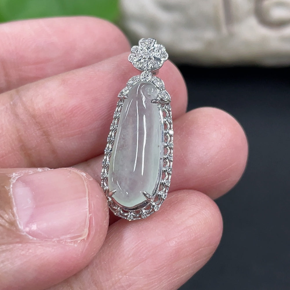 Jadeite blessing melon pendant set in 18K gold with small diamonds, crafted by HKHQ, showing the detailed carved jade surface.