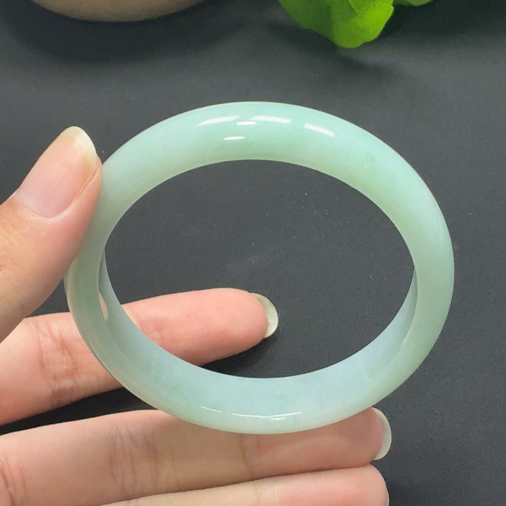 Jadeite round bangle with a size of 55.8, featuring smooth polished surface and a total weight of 45.69g, by HKHQ.