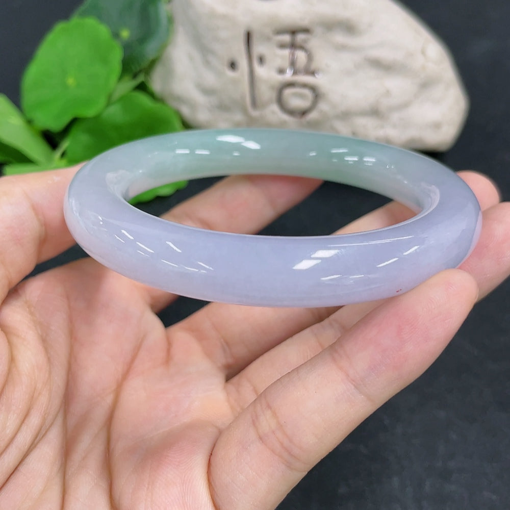 HKHQ jadeite round bangle size 57.1 with a smooth, polished surface and a weight of 70.28g showcasing fine craftsmanship.