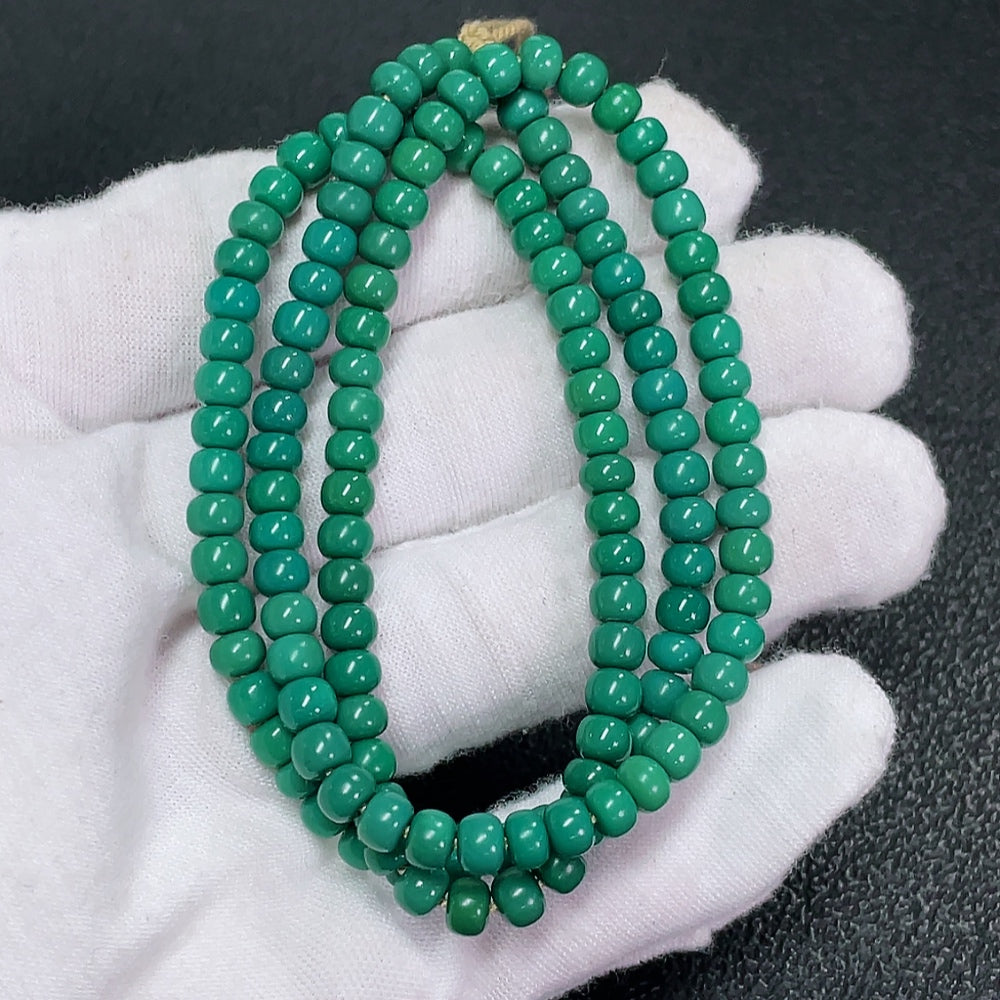 Turquoise gemstone bead strand with 4.8mm beads, approximately 18.28g, from HKHQ, showcasing vibrant blue-green color.