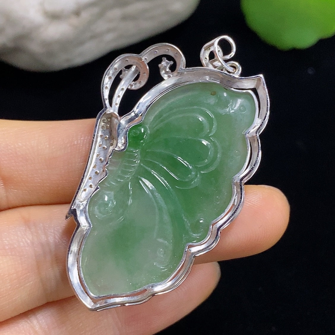 Jadeite butterfly inlay pendant by HKHQ with 18k gold accents and diamond details, showcasing intricate craftsmanship and elegant design.