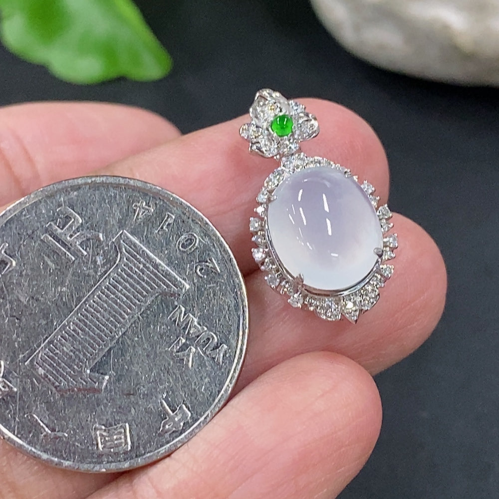 Jadeite cabochon pendant with 18K gold setting and diamond accents, showcasing a smooth green jade stone on a delicate chain
