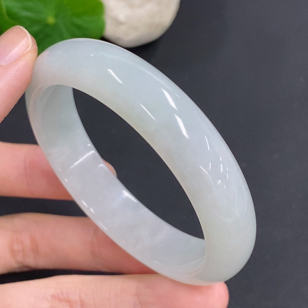 Jadeite round bangle with a total weight of 52.7g, size 55.7, crafted by HKHQ, showcasing smooth, polished jade surface.