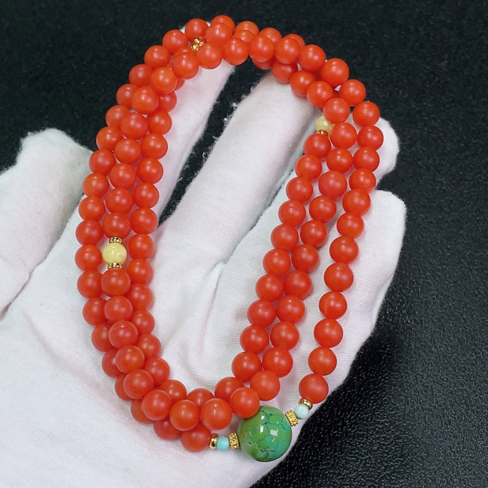 South Red Agate and Amber bead strand with turquoise accents, featuring visible organic matter and non-metallic stones, 7mm size.