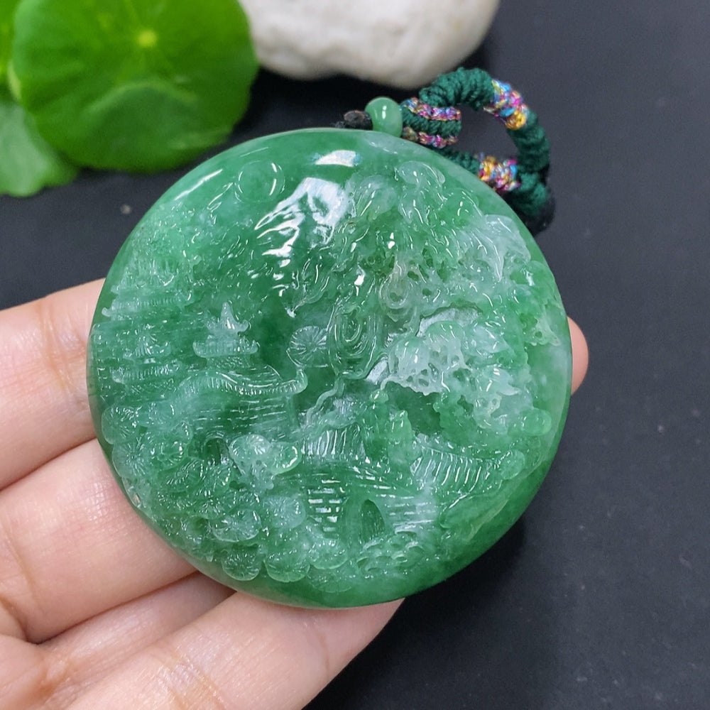 Jadeite landscape pendant necklace with cord, crafted by HKHQ, weighing approximately 66.1 grams, featuring detailed jadeite carvings.
