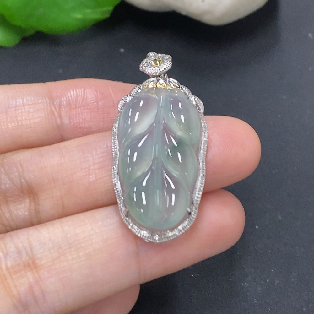 Jadeite leaf inlay pendant with 18K gold setting, HKHQ necklace, showing detailed leaf design on a white background.