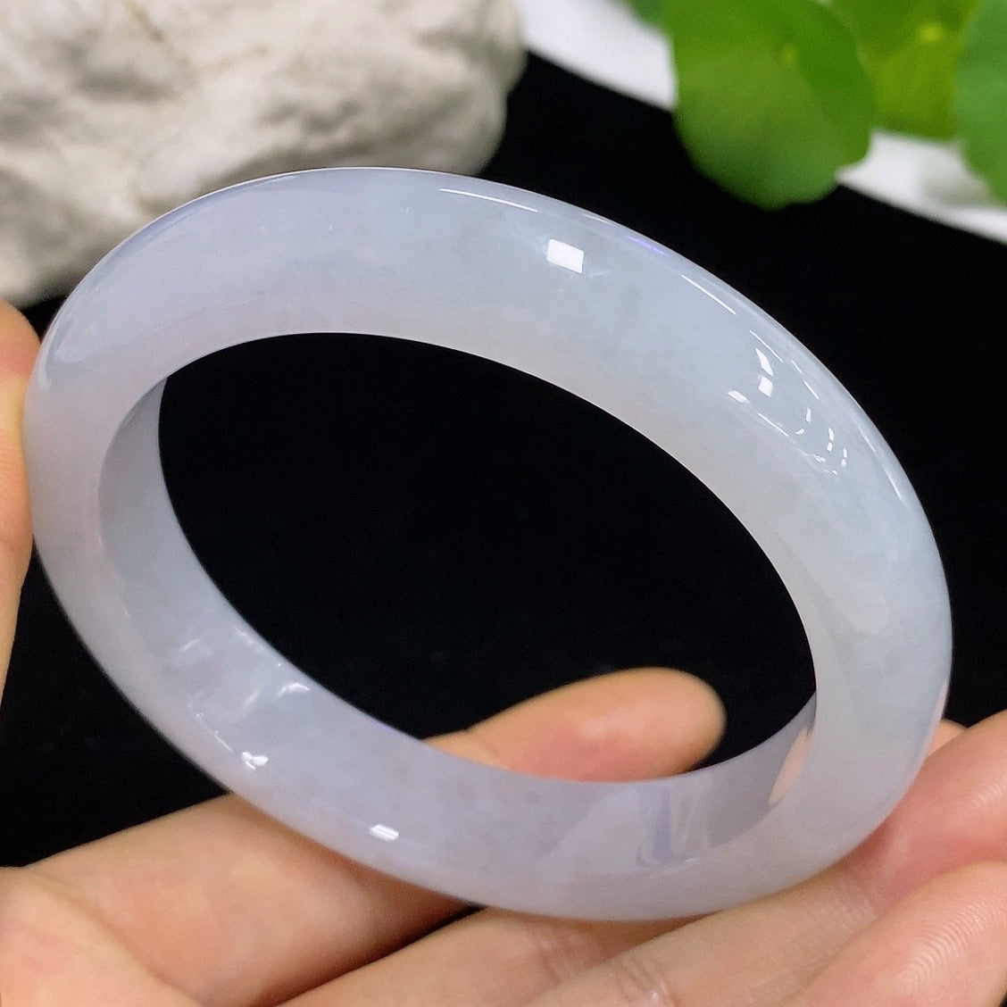 Jadeite round bangle with size 58.8 and weight 64.88g, crafted from green jade, featuring a smooth, polished surface.