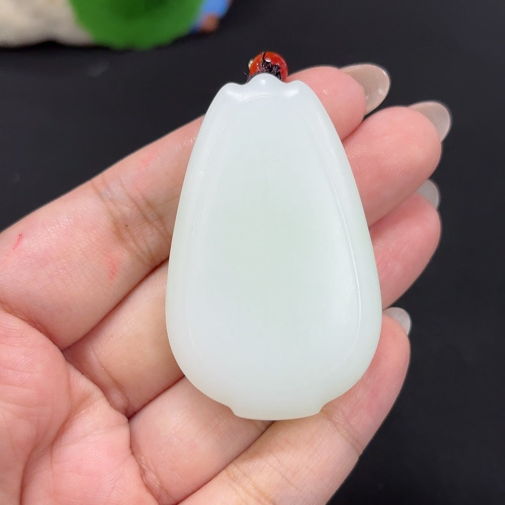 HKHQ Hetian Jade Pendant with cord, plain design, weighs approximately 48.1g, showcasing smooth, polished green jade.