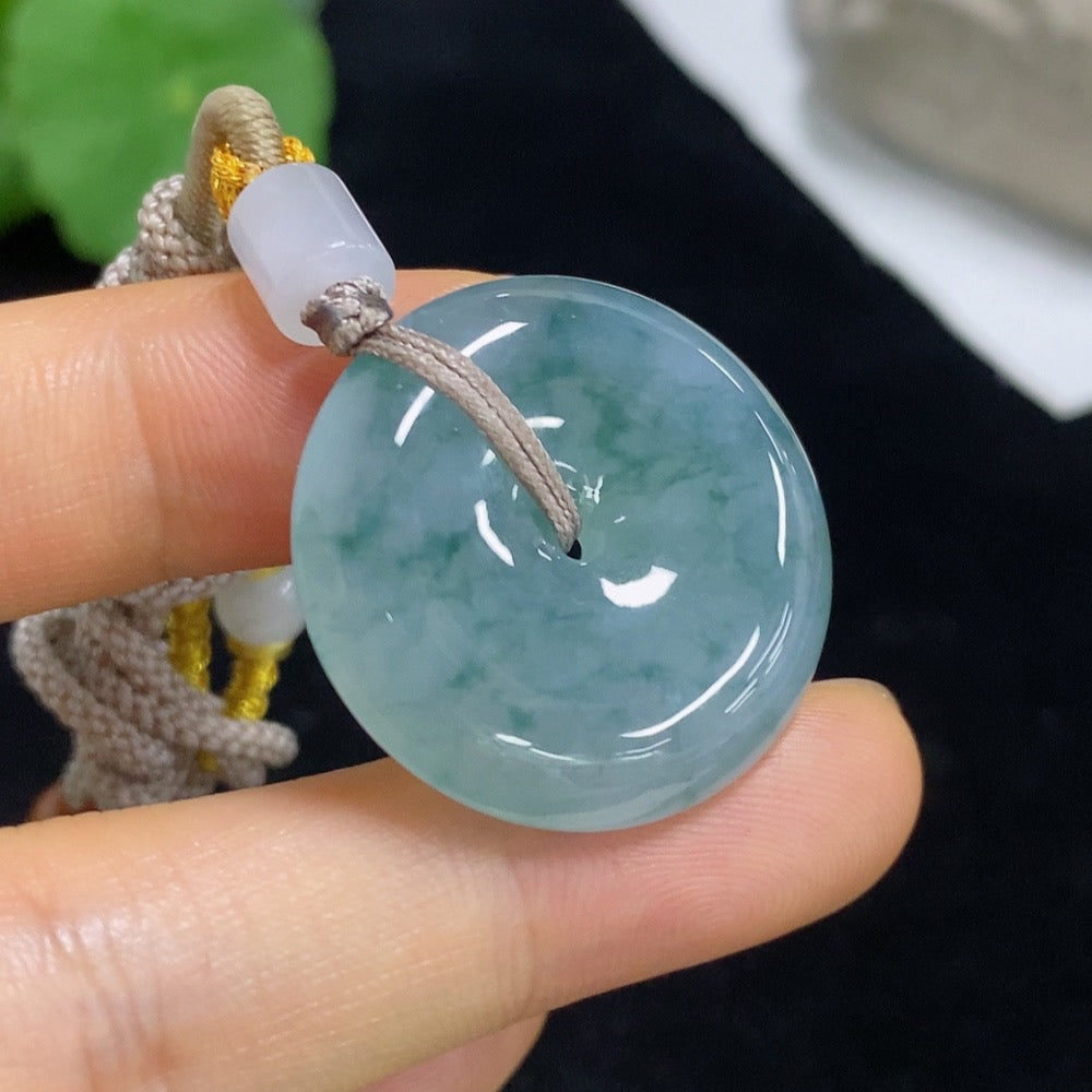 Jadeite Peace Knot pendant with a jade jade pendant on a cord, weighing approximately 12.94 grams, crafted by HKHQ.
