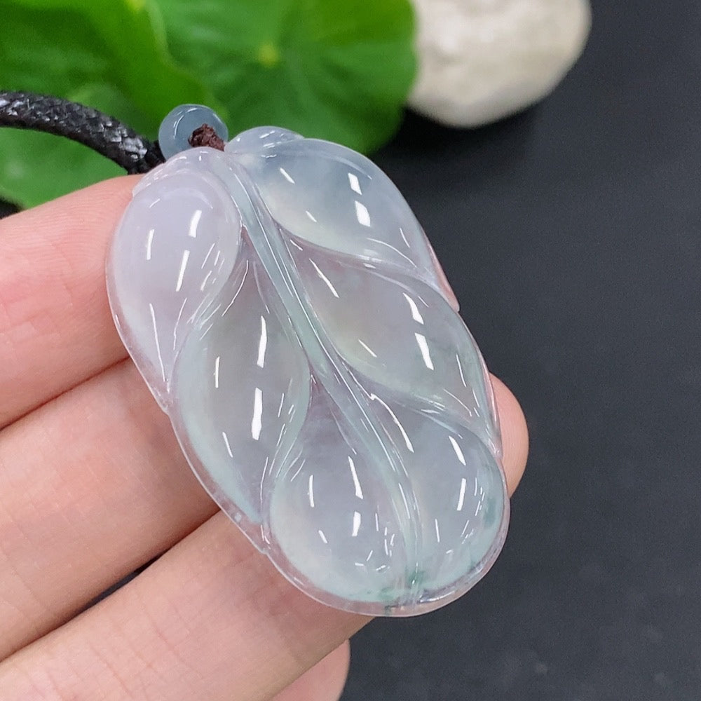 Jadeite leaf pendant necklace by HKHQ featuring a detailed green jadeite leaf charm on a delicate chain.