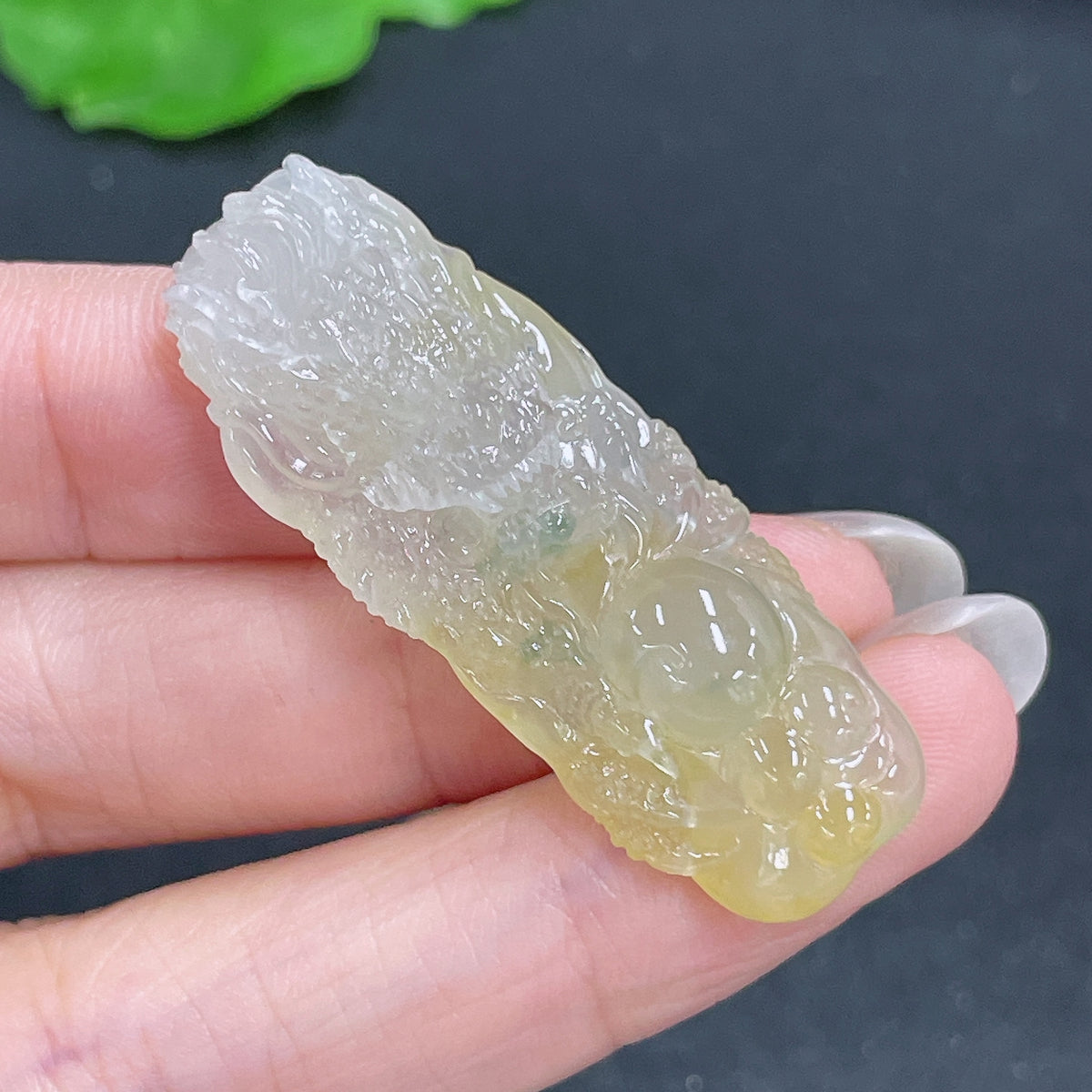 Jadeite pendant featuring a carved dragon plaque, crafted from green jade, weighing approximately 10 grams, by HKHQ.