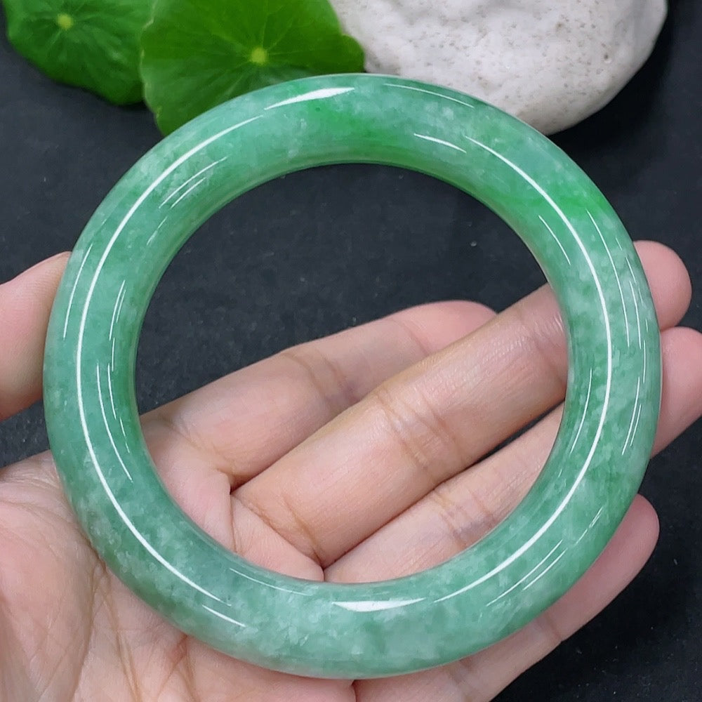 Jadeite round bangle with a 55.5mm diameter, weighing approximately 77g, featuring smooth, polished jade surface.