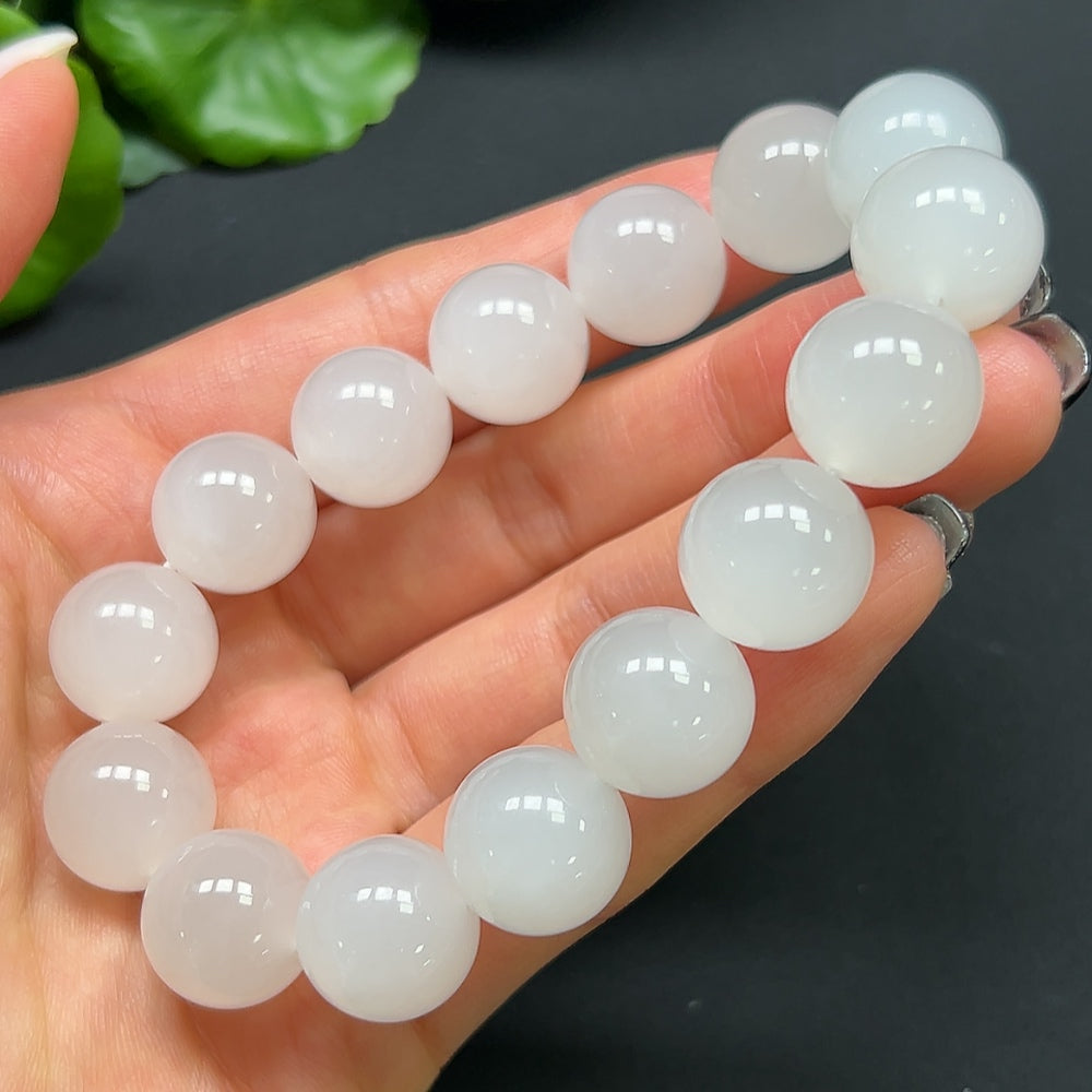 Hetian Jade bracelet with 14mm beads from HKHQ, featuring smooth, polished green jade stones on a delicate bracelet.