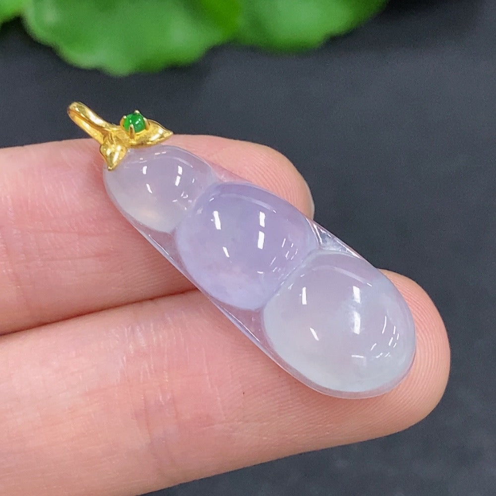 Jadeite lucky bean pendant with 18k gold clasp, smooth green jade with gold accents, weighs approximately 3 grams.