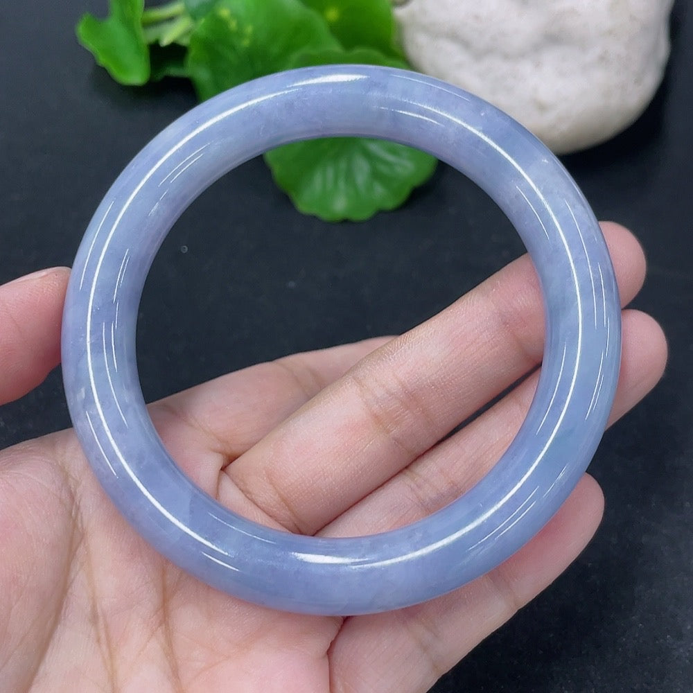 Jadeite round bangle in size 56mm, weighing approximately 54g, featuring smooth green jade surface and crafted by HKHQ.