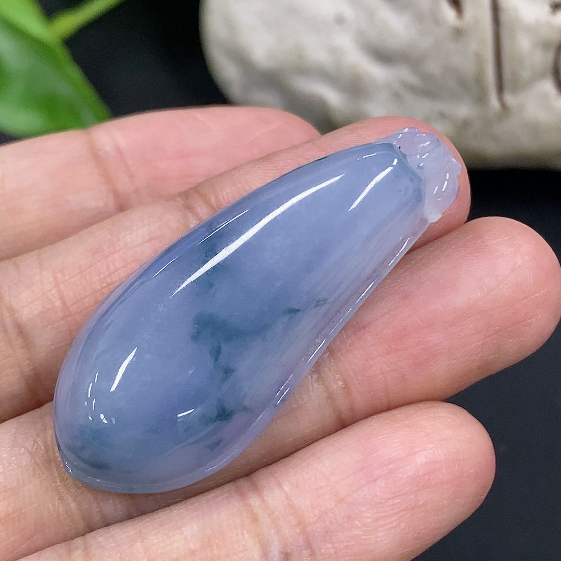 Jadeite auspicious gourd pendant from HKHQ, carved from green jade, weighing approximately 10.4 grams, with intricate details.