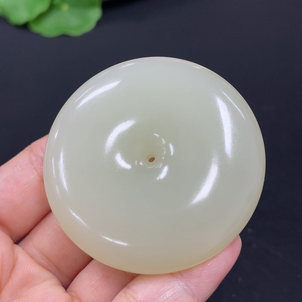 Hetian jade pendant with peace knot design, crafted from high-quality jade, weighing approximately 58.6g, by HKHQ.