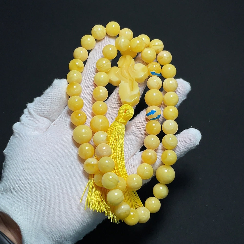 Amber beeswax bead strand with visible repairs, 11.4-14mm, weighing approx. 60.86g, from HKHQ, natural and organic jewelry material.