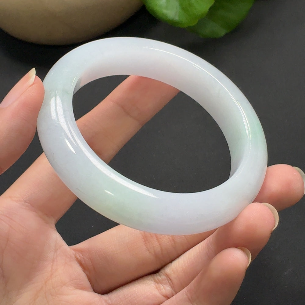 Round jadeite bracelet with size 54.3, weighing approximately 68.93g, featuring polished jade stones from HKHQ.