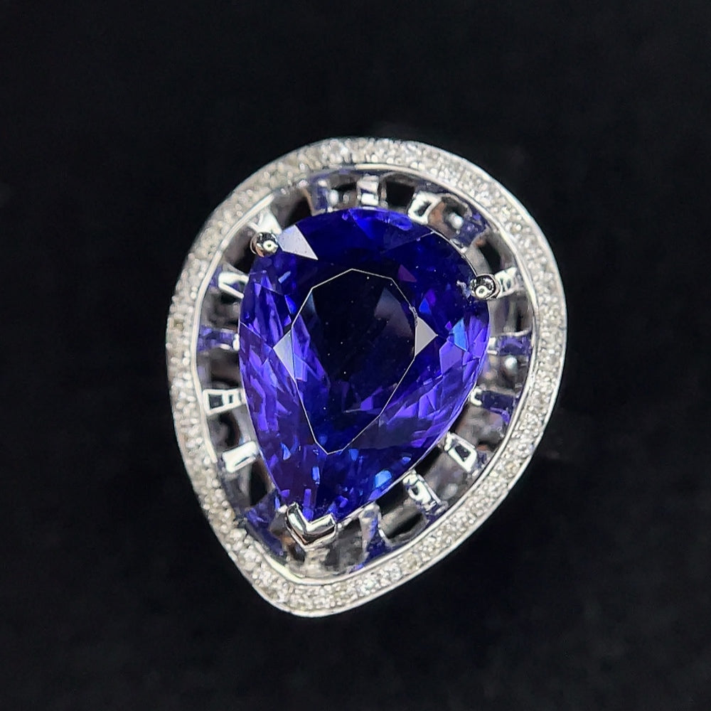 18K gold Tanzanite ring with diamond accents, size 11, featuring a vibrant gemstone and elegant jewelry design.