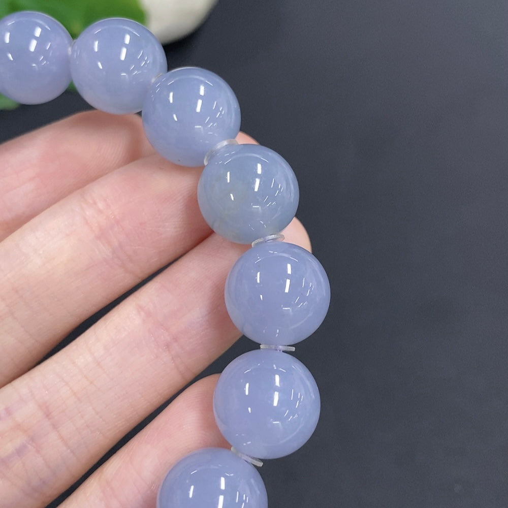 Jadeite bracelet from HKHQ featuring smooth, round jade stones weighing approximately 56.7g and measuring about 12.7mm each.