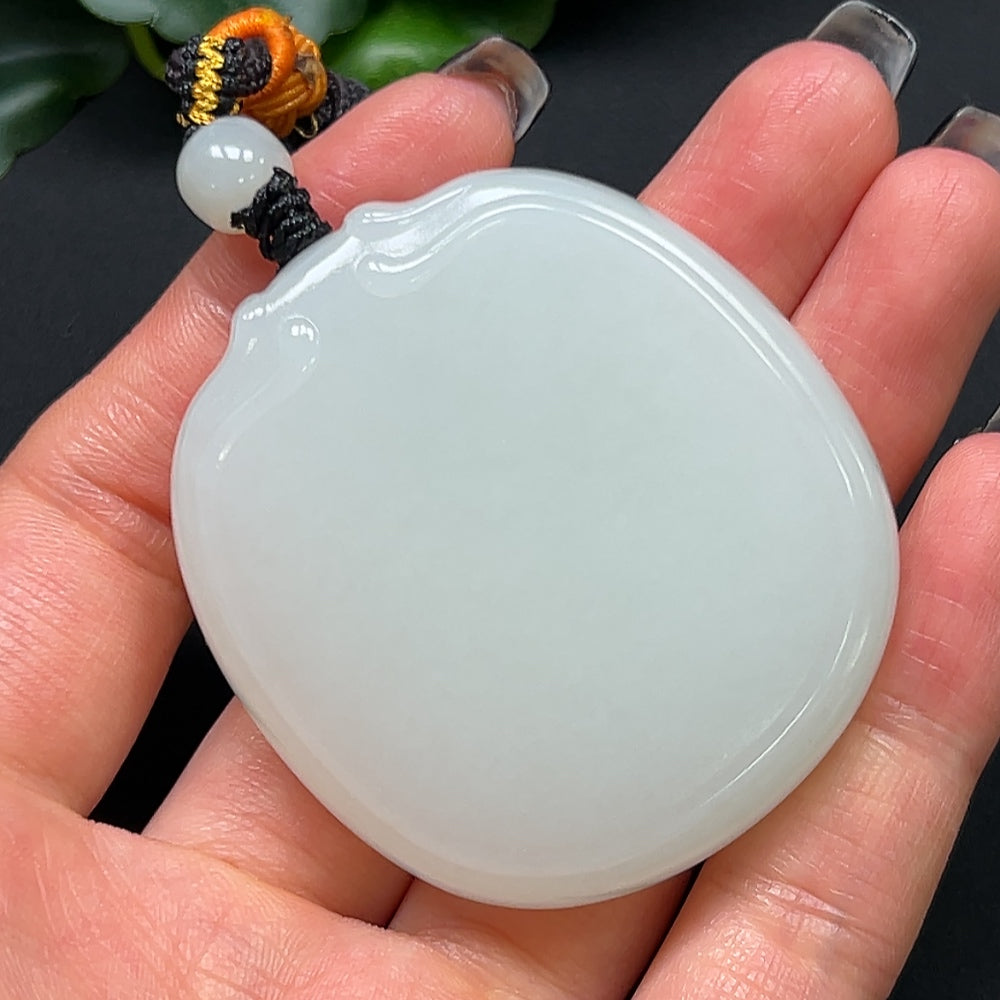 HKHQ Hetian jade plain pendant with rope, weighs approximately 64.08g, showcasing smooth, polished jade craftsmanship.