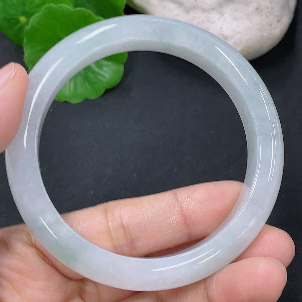 Jadeite round bangle in size 54.5mm with a total weight of 50.76g, showcasing smooth, polished jadeite jewelry.