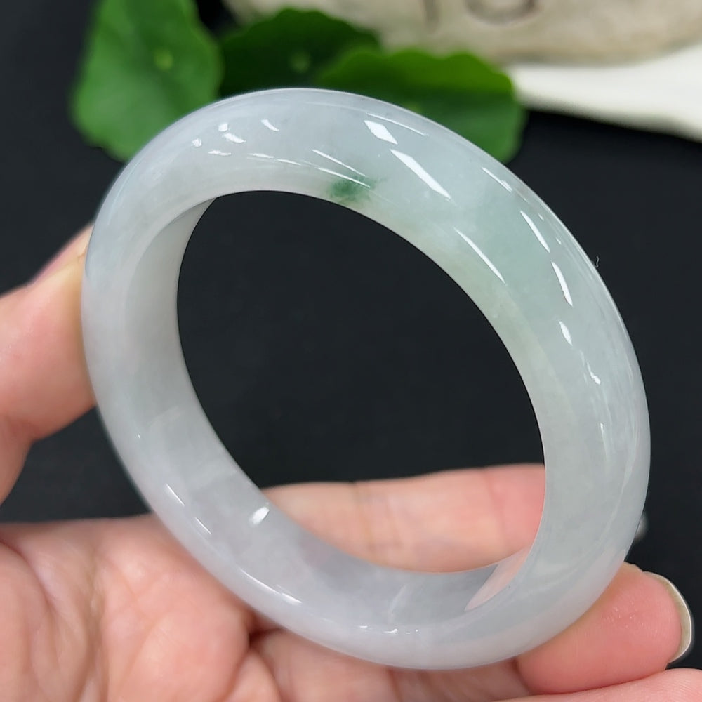HKHQ jadeite round bangle, size 54.6, weighing approx. 59.5g, showcasing smooth, polished green jade surface.