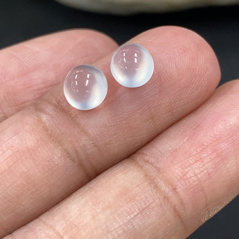 Small jadeite cabochon jewelry piece from HKHQ, showcasing a smooth, polished green gemstone weighing 0.49g.