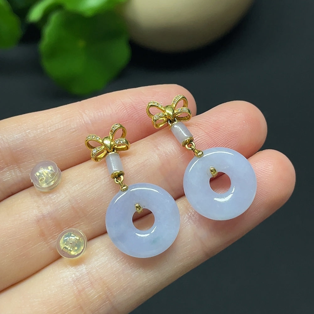 Jadeite donut earrings by HKHQ featuring 18K gold accents and diamond details, shown against a white background.