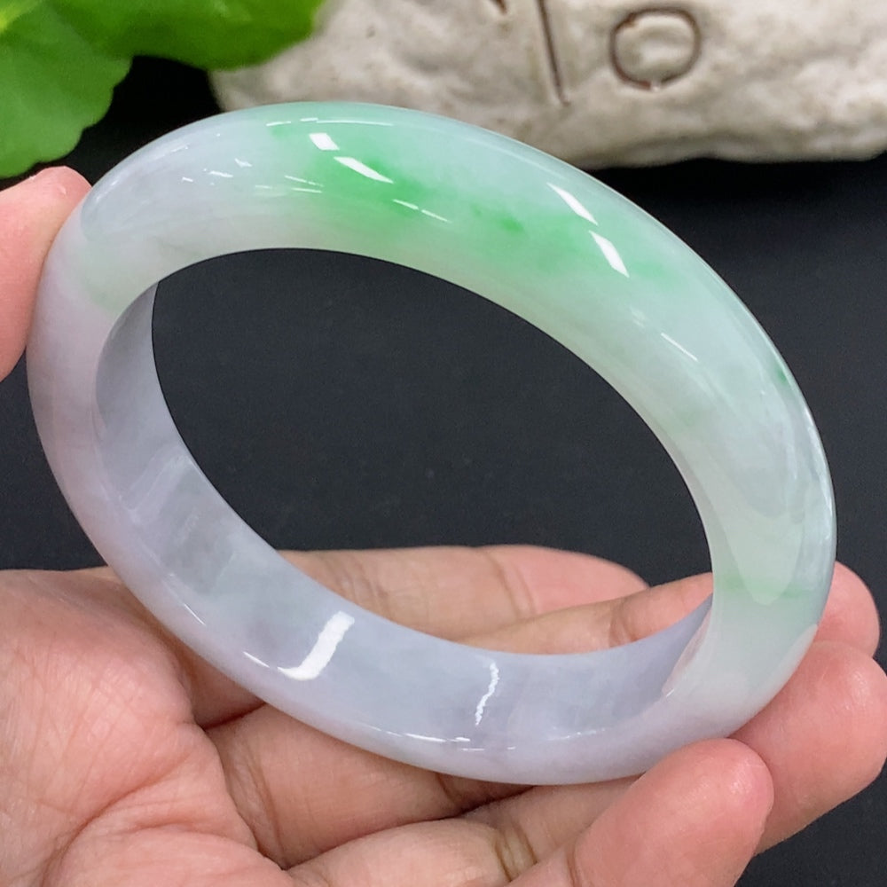 HKHQ jadeite round bangle bracelet, size 57.1, weighing 64.6g, showcasing smooth, polished green jadeite in a circular design.