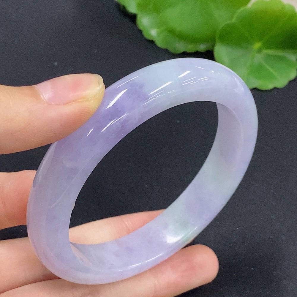 Jadeite round bangle in size 56.7 with a total weight of approximately 58.98g, showcasing smooth, polished green jade from HKHQ.