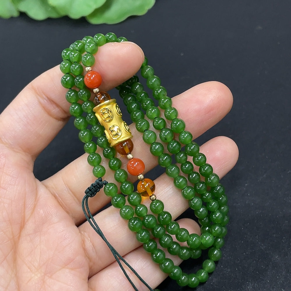 Hetian Jade beaded necklace by HKHQ featuring smooth, polished jade beads on a delicate string.