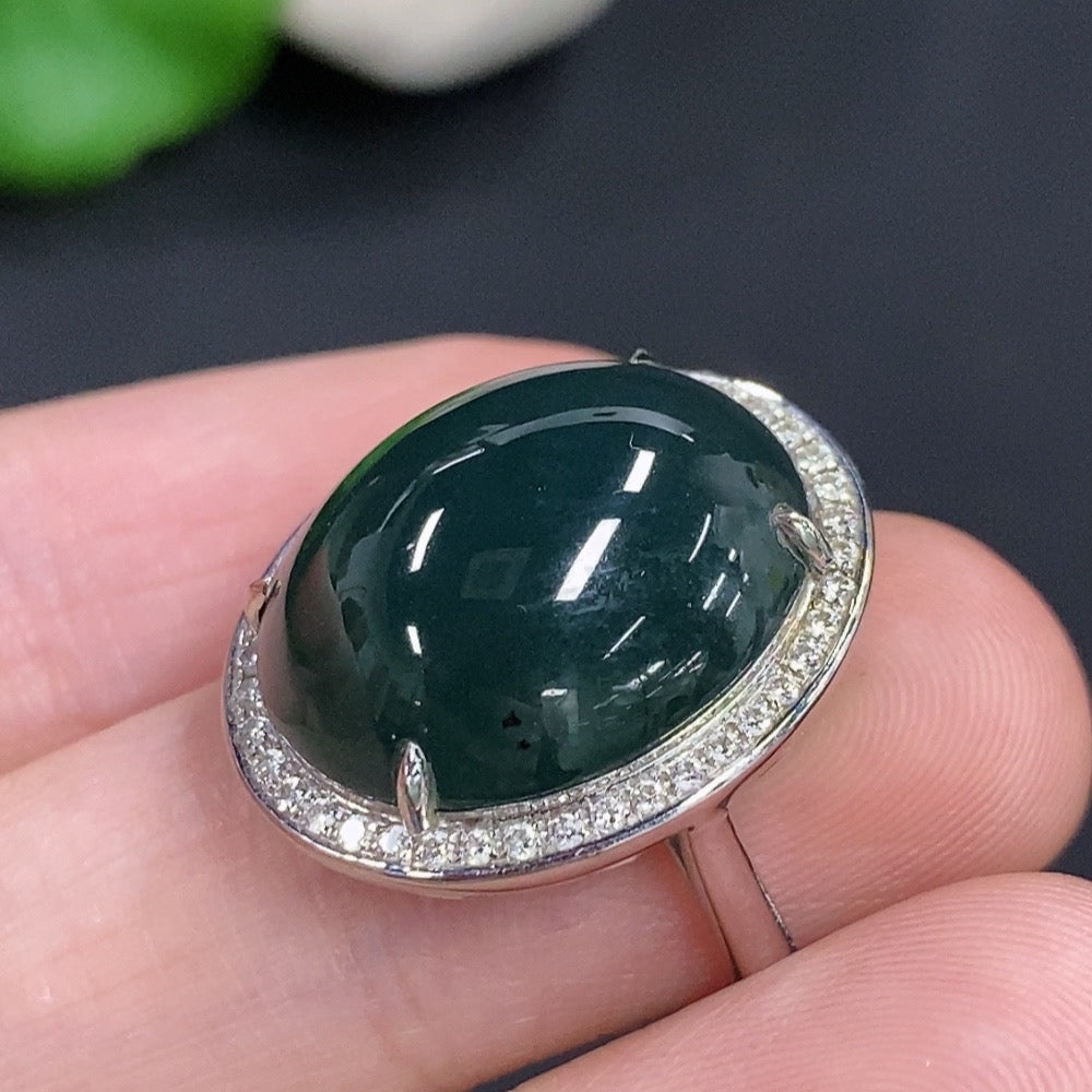 Jadeite cabochon ring with diamond accents in 18k gold, size 14, weighing approx. 7g, featuring a polished jade stone.