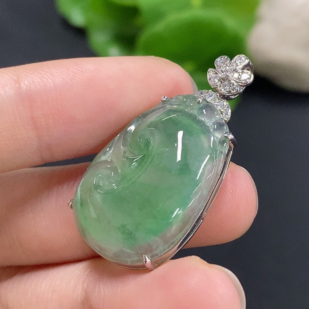 Jadeite Ruyi pendant with 18K gold and diamond accents, featuring intricate inlaid design and a polished jade finish.