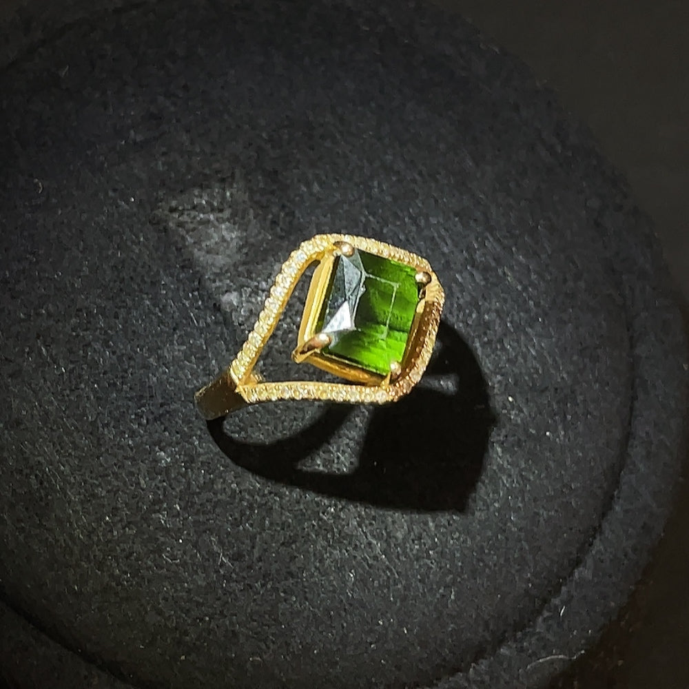 18k gold tourmaline ring with gemstone accents, size 12, weighing approximately 2.93g, featuring a vibrant tourmaline centerpiece.