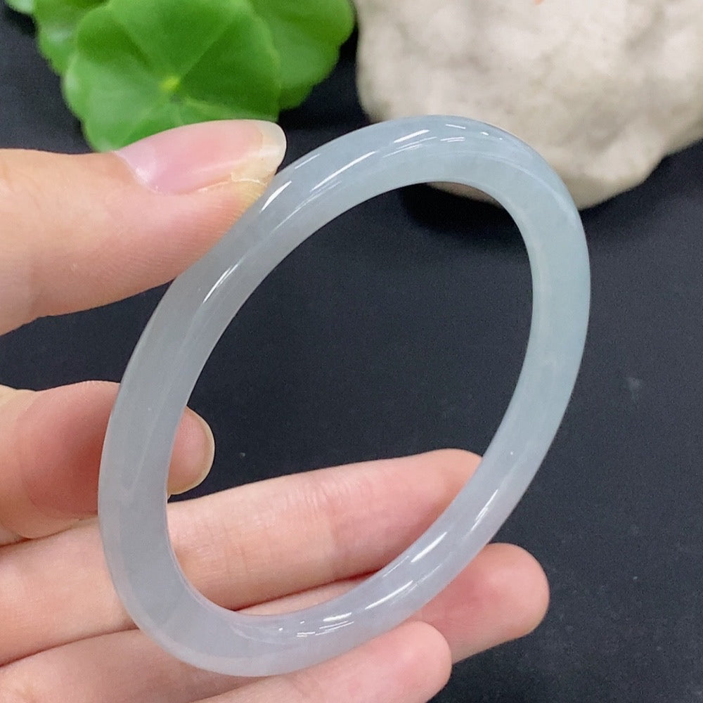 Jadeite round bangle in size 55.7 with a total weight of 23.89g, showcasing smooth, polished jadeite from HKHQ.